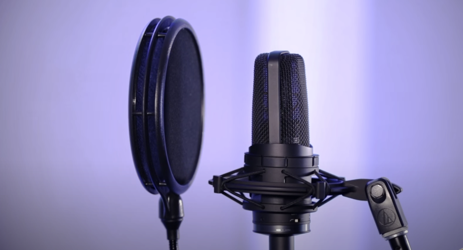 Photo of a black Audio-Technica AT4050 microphone with a filter attached