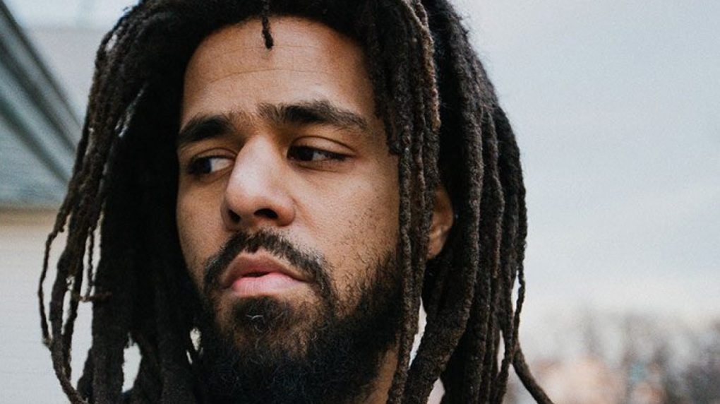 J. Cole, the multi-talented rapper and producer looks away