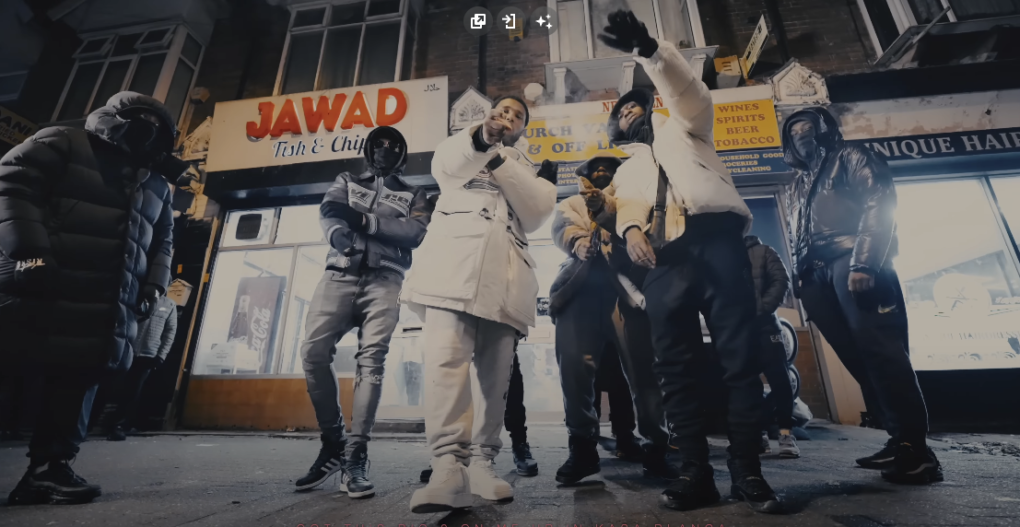 Photo of a group of people standing outside an establishment