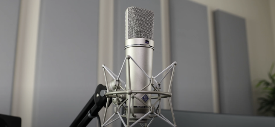 Photo of a silver Neumann U87 microphone on a silver stand