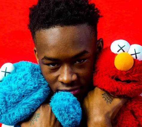 Rapper Rico Cartel with toys