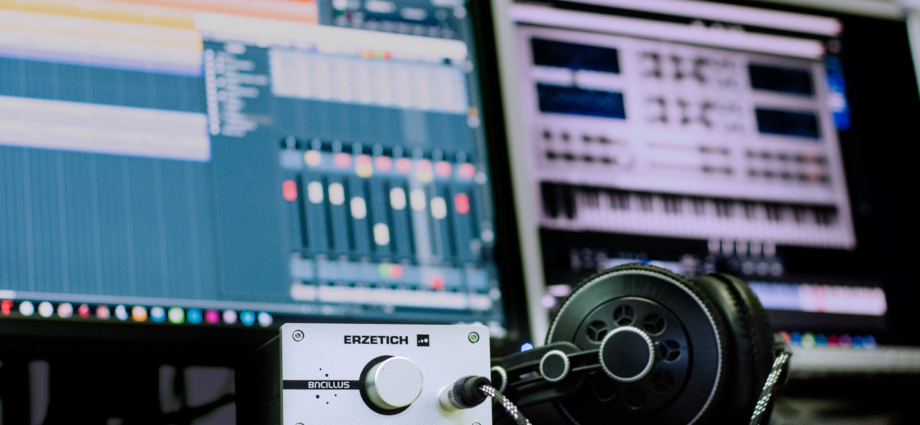 A view of the recording studio's live room, showcasing instruments and recording equipment.