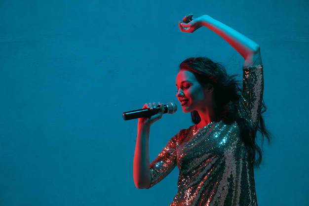 The girl on the stage sings a song