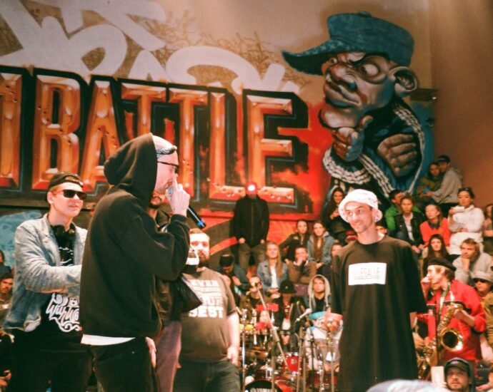 rapper rapping on stage for people.